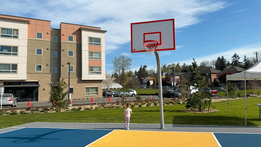 young girl on half-court with basketball hoop at Cheryl Chow Park