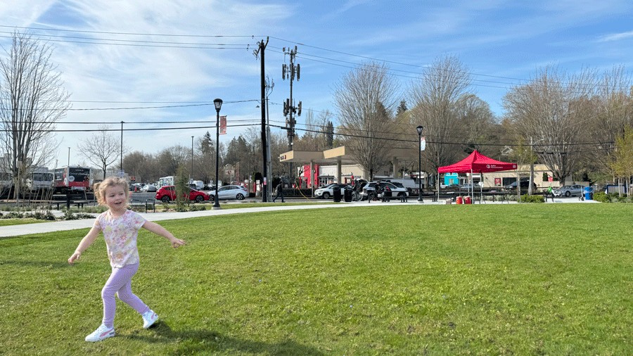 young girl on lawn for picnics at Cheryl Chow Park