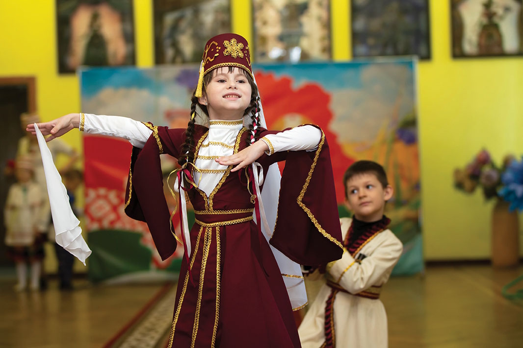 Child dancing in traditional cultural outfit