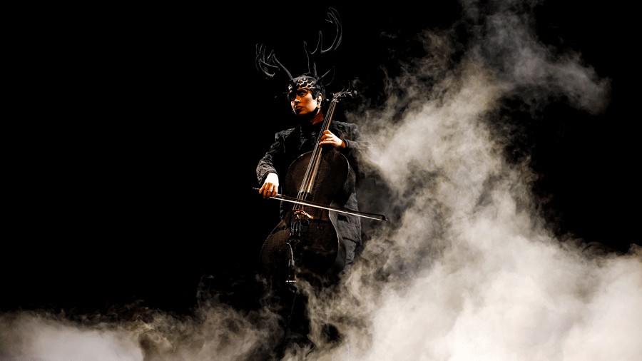 musician playing onstage during "Echo" with smoke billowing around them
