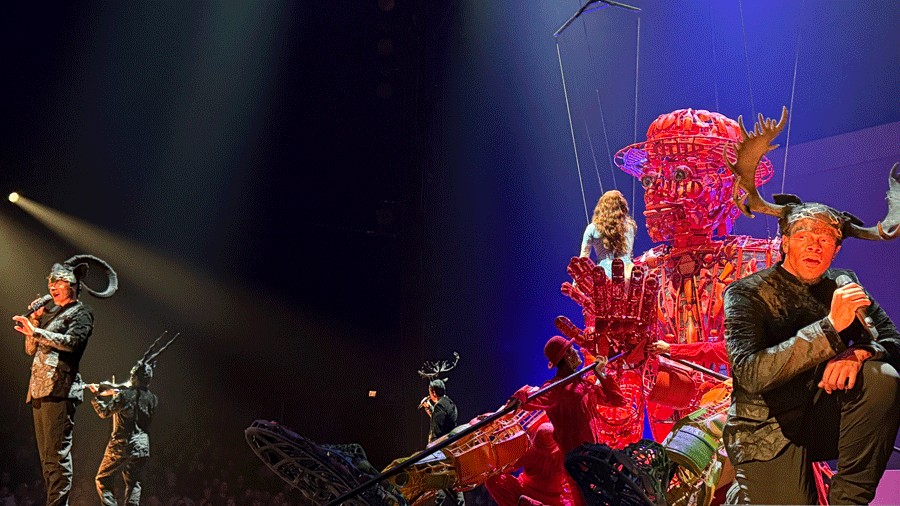 a giant red puppet onstage during "Echo" with performers