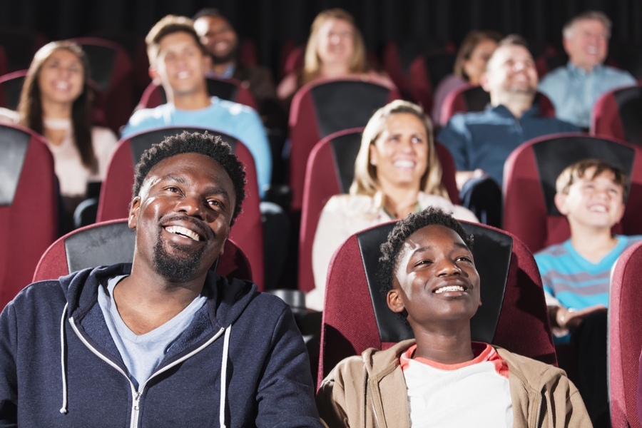 dad and son watching a movie together
