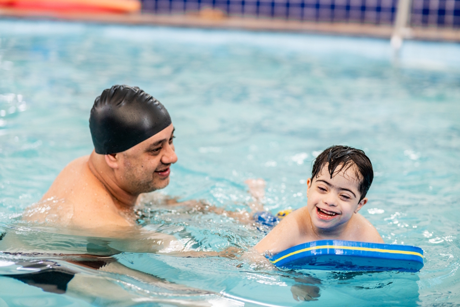 Dad and son in an indoor swimming pool