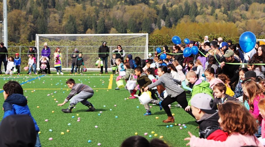 Kids race to collect eggs at a local Easter egg hunt.