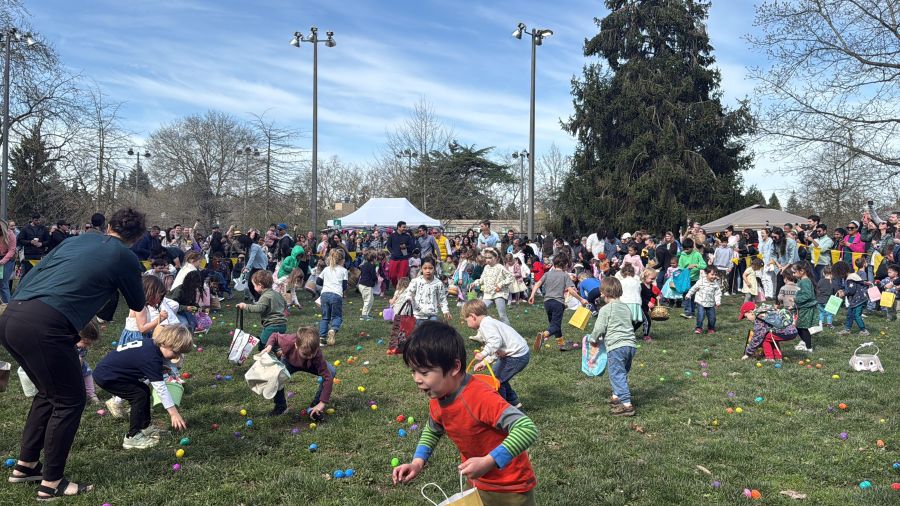 Kids collect eggs for Easter in an outdoors egg hunt.