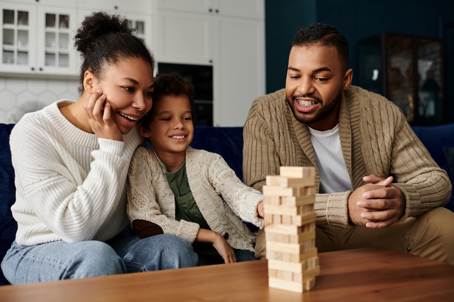 Family playing a game and taking turns