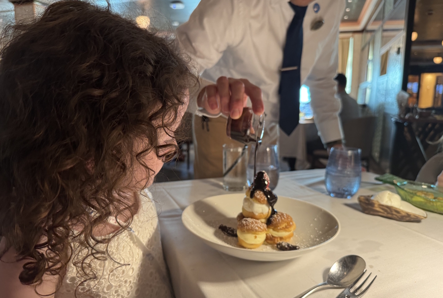 young girl having a fancy dinner on an Alaska cruise