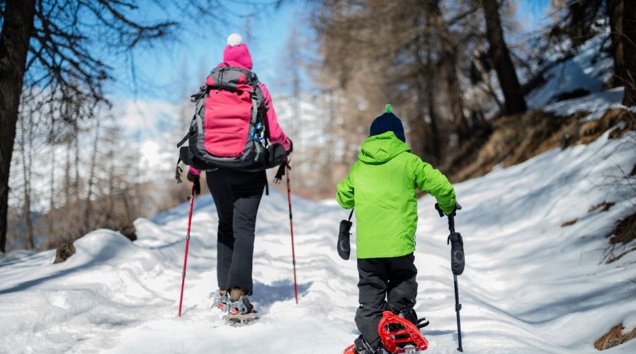 A mom and child show shoe together.