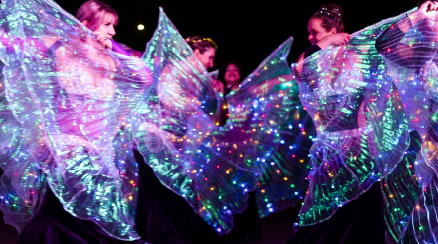 Colorfully lit artists parade around Tacoma as part of the Tacoma Light Trail.