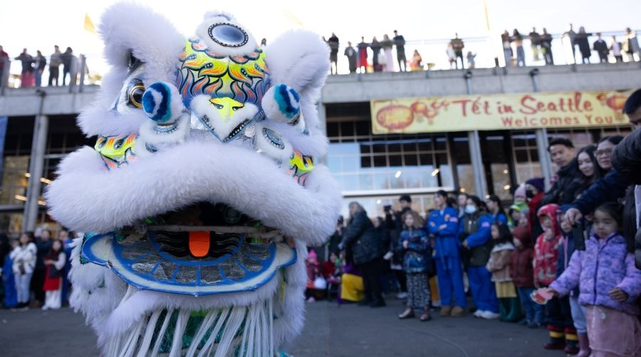 A crowd watches a dragon dance during Lunar New Year festivities.
