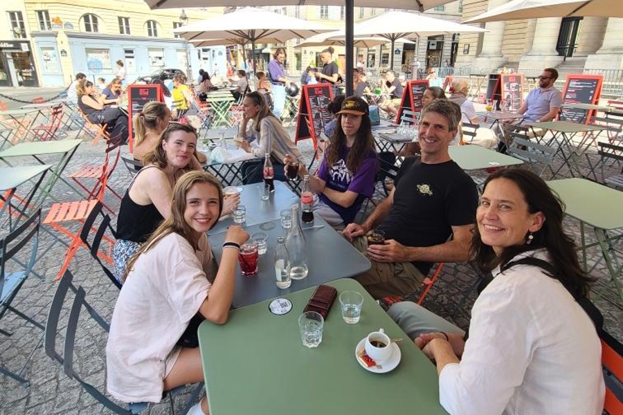 three families at a cafe in Paris together