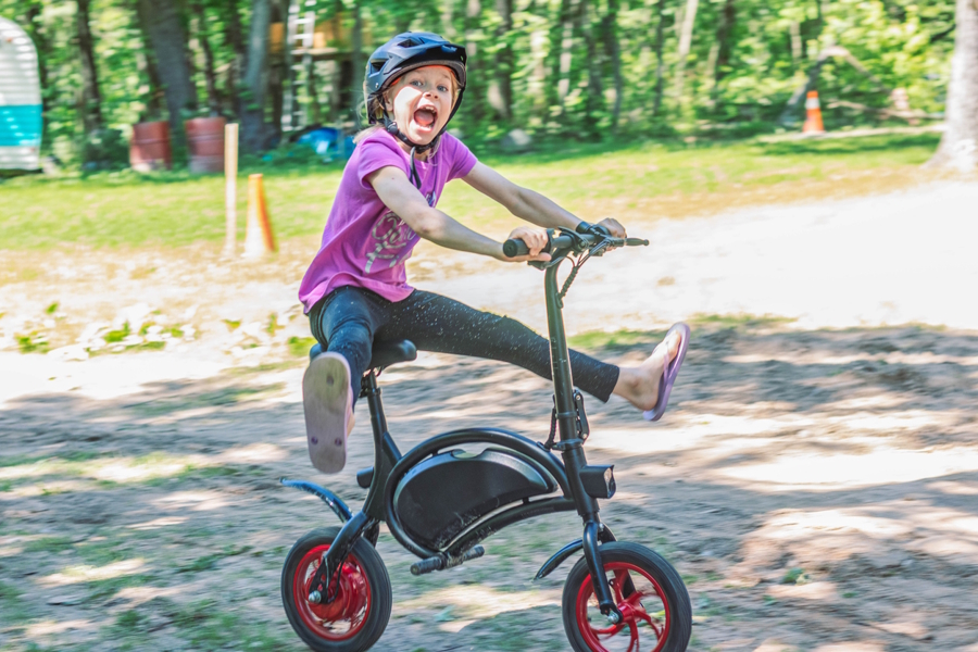 young girl riding an electric bike