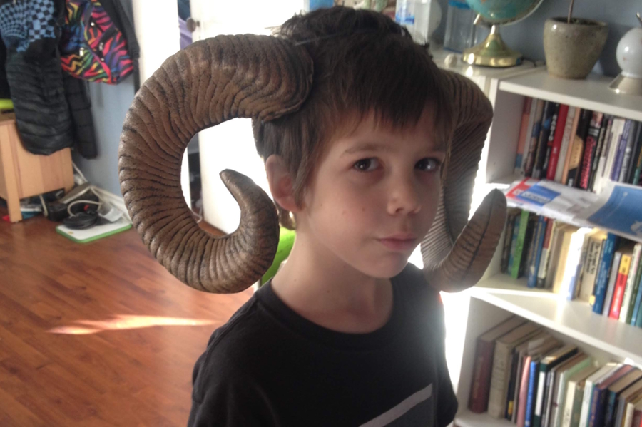 Young boy with horns for a Halloween costume