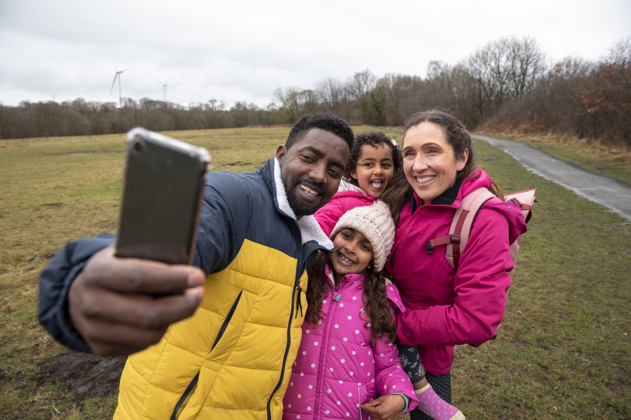 Dad taking a selfie of the whole family