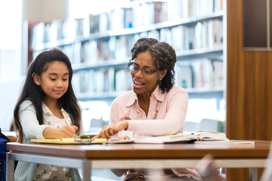 Girl getting homework help at a local library