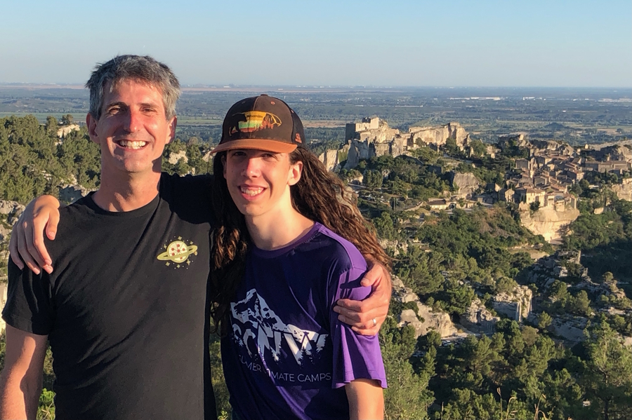 dad and son smiling in France on a trip together