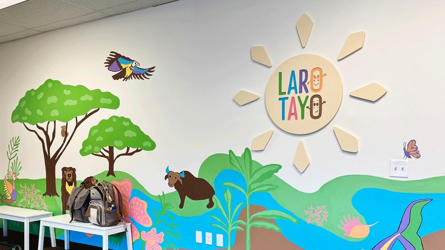 colorful mural and sign at Laro Tayo, a new indoor play space in Kent for families