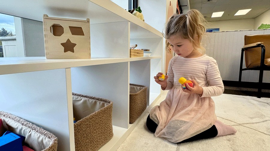 child playing with soft toys in the younger children's playground area at Laro Tayo