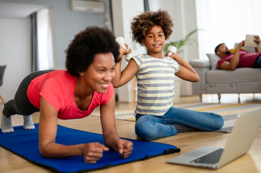 mom and daughter working out with an exercise app