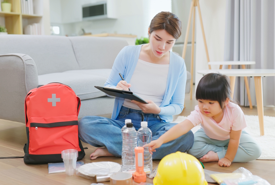 mom putting together an emergency backpack