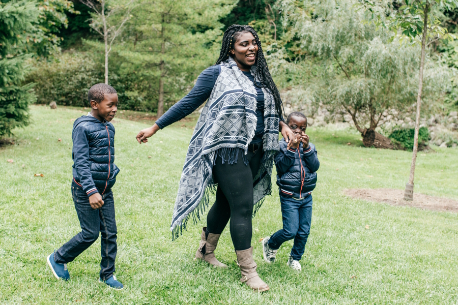 mom walking on the park with her two sons