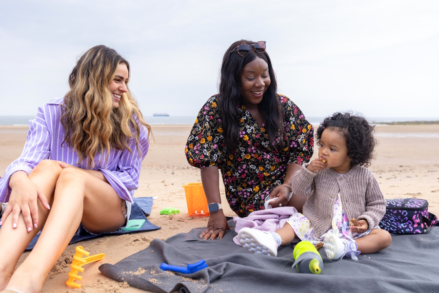 mom friends on the beach with baby