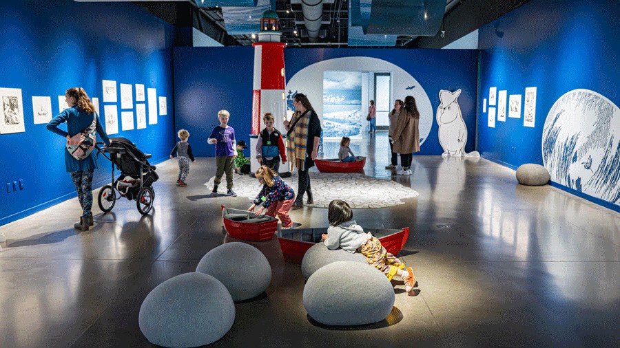 kids playing on the interactive island at the new moomin exhibition in seattle