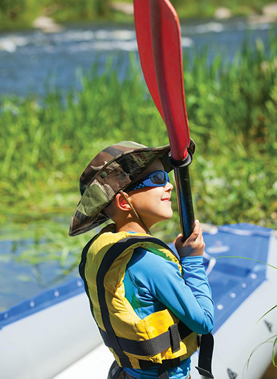 Kid holding paddle