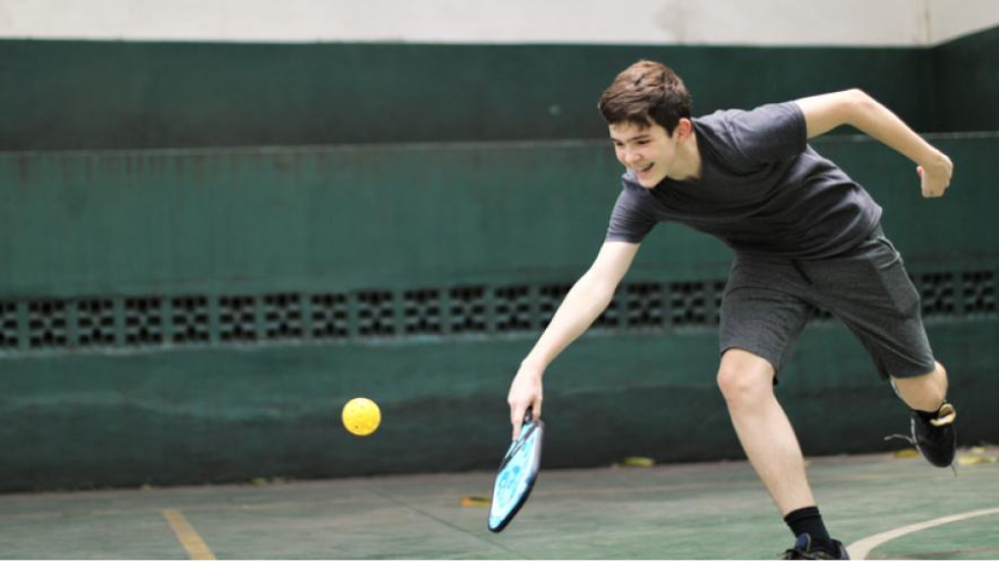 boy playing pickle ball