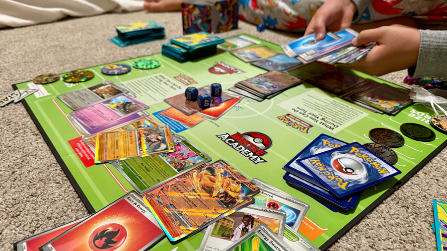 pokemon game board with cards laid out on it