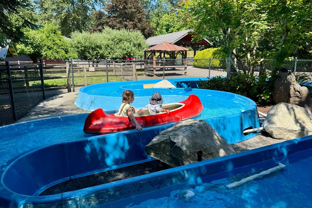 kids in small canoes at Remlinger Farm Fun Park in Carnation