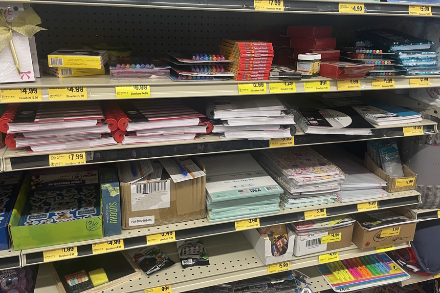 a shelf filled with school and office supplies at Grocery Outlet