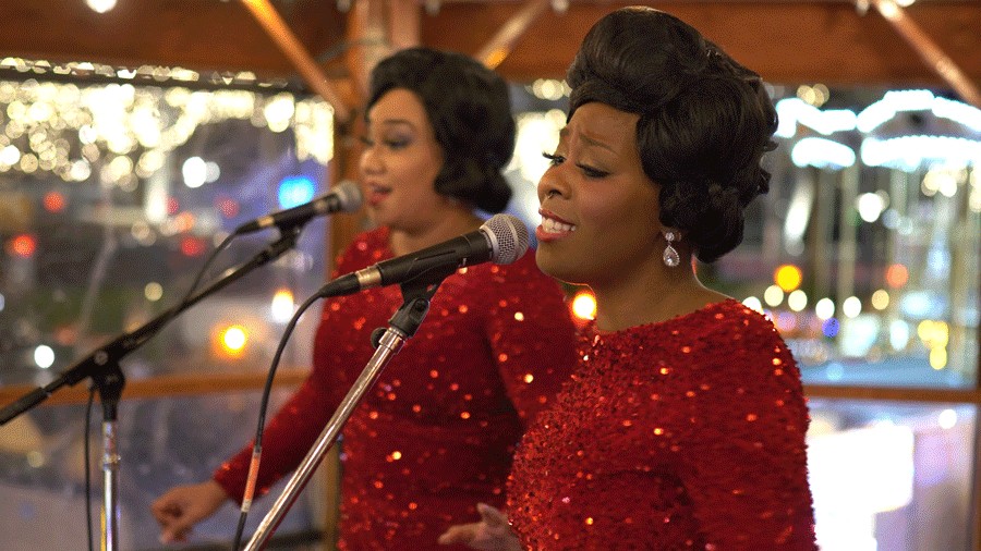 performers in festive red outfits at Seattle Christmas Market