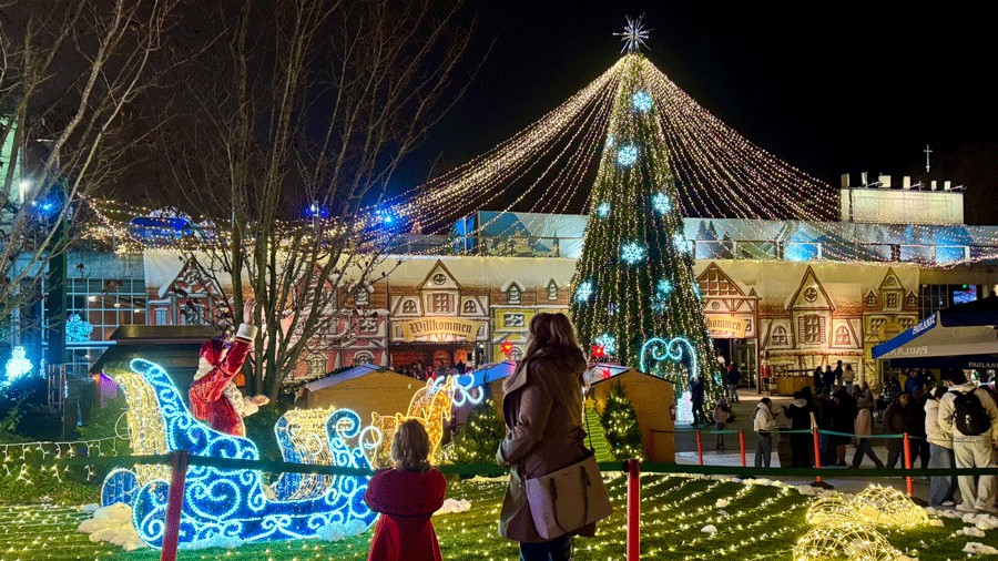 young girl and woman admiring christmas light displays at Seattle Christmas Market