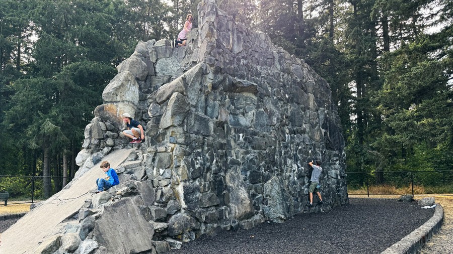 kids and adults climbing SPIRE Rock in Tacoma
