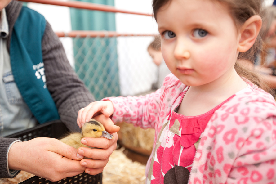 girl with duck at the fair