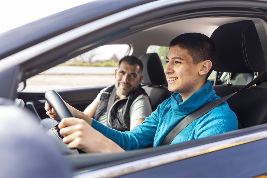 teenager in the car for drivers ed lesson