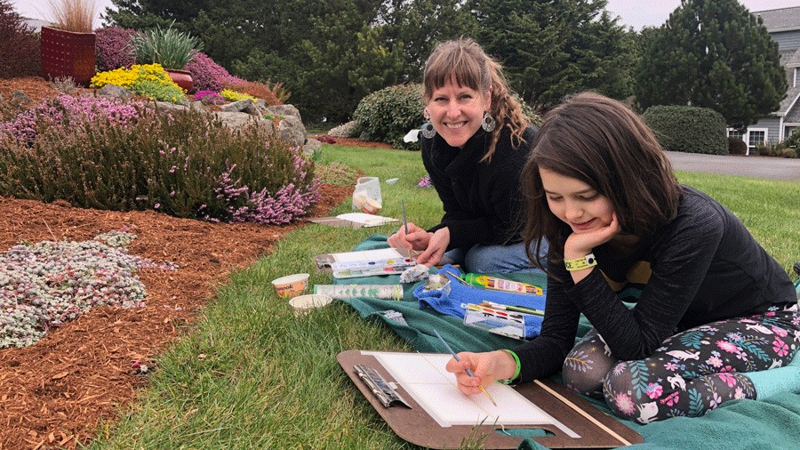 mother and daughter painting during a family art class in port townsend