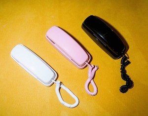 Tin Can phones in white, pink and black