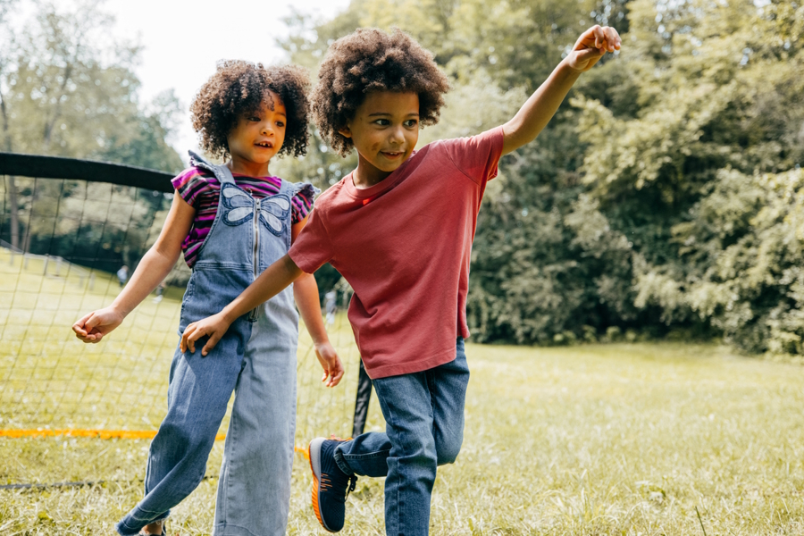 two kids playing outside together