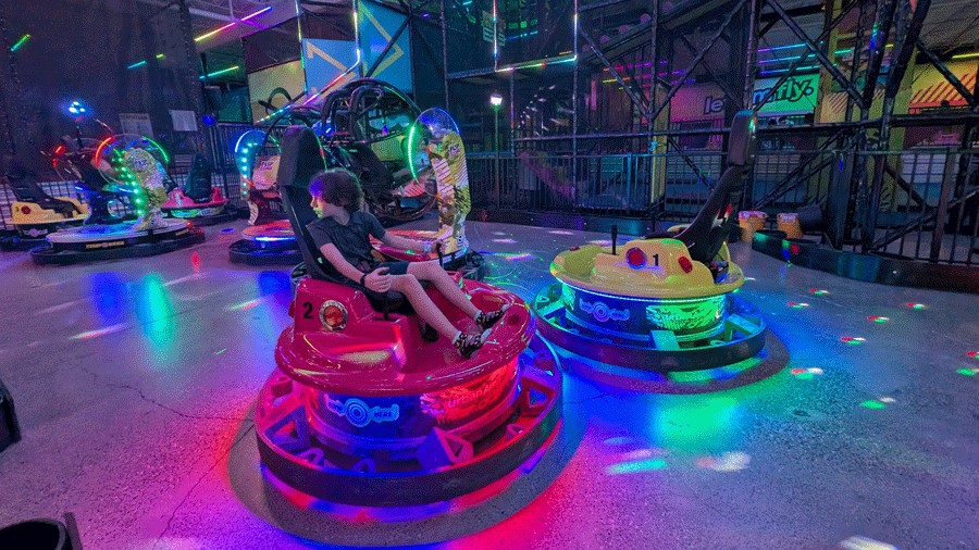 kids riding spinning bumper cars at urban air tacoma