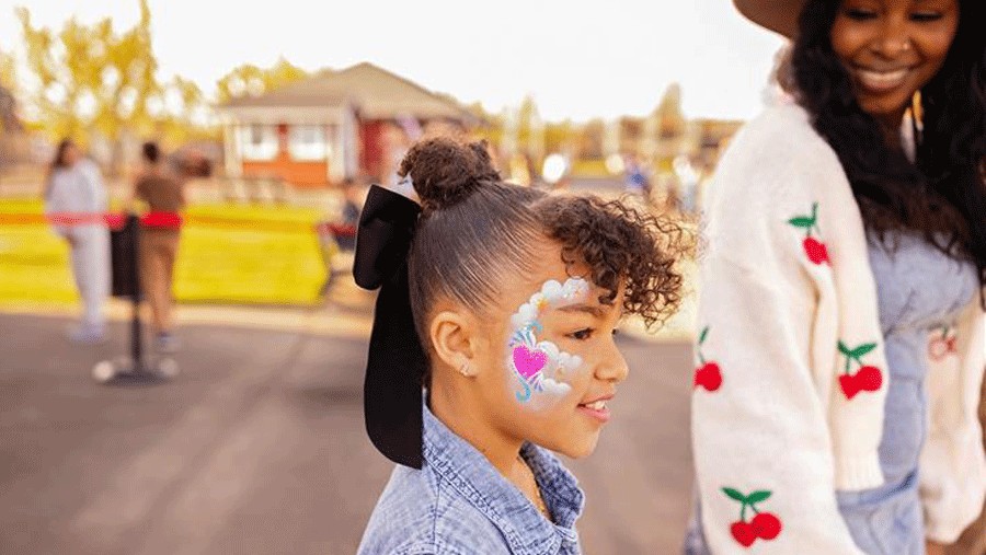 girl with heart face painting, done for free at the Washington State Fair