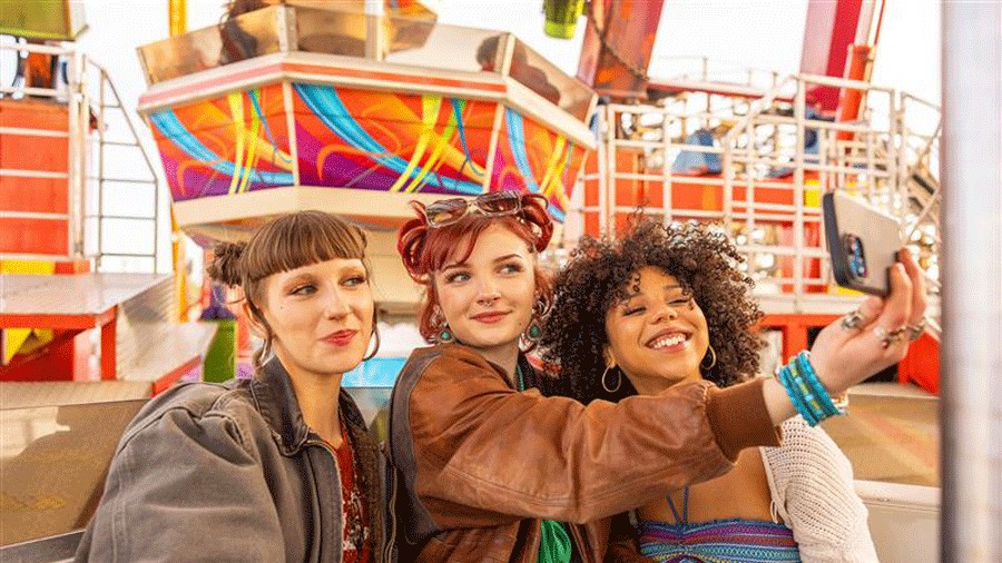 teens taking a selfie on a ride at the Washington State Fair