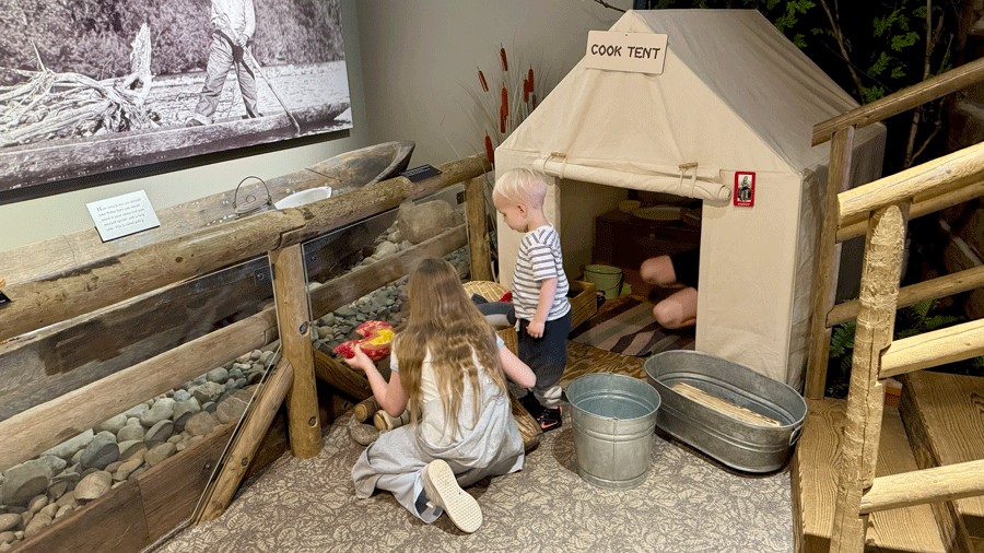kids playing at an interactive exhibit at White River Valley Museum, a free museum near Seattle