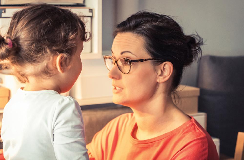 mother calming down anxious daughter