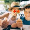 two kids with strawberries on sticks show of healthy lunch ideas for camp or travel