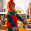 Little boy in Halloween costume with mom