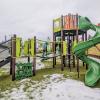 New Lakeridge Playground in South Seattle, kids play on play structure on a snowy day