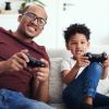 Dad-and-young-son-playing-video-games