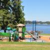 Kids play at waterfront Lake Meridian Park in Kent on a sunny day